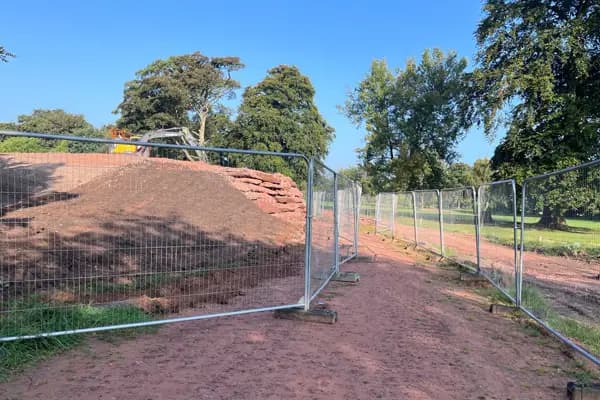 Heras-style temporary mesh fencing panels installed to create a secure site perimeter.